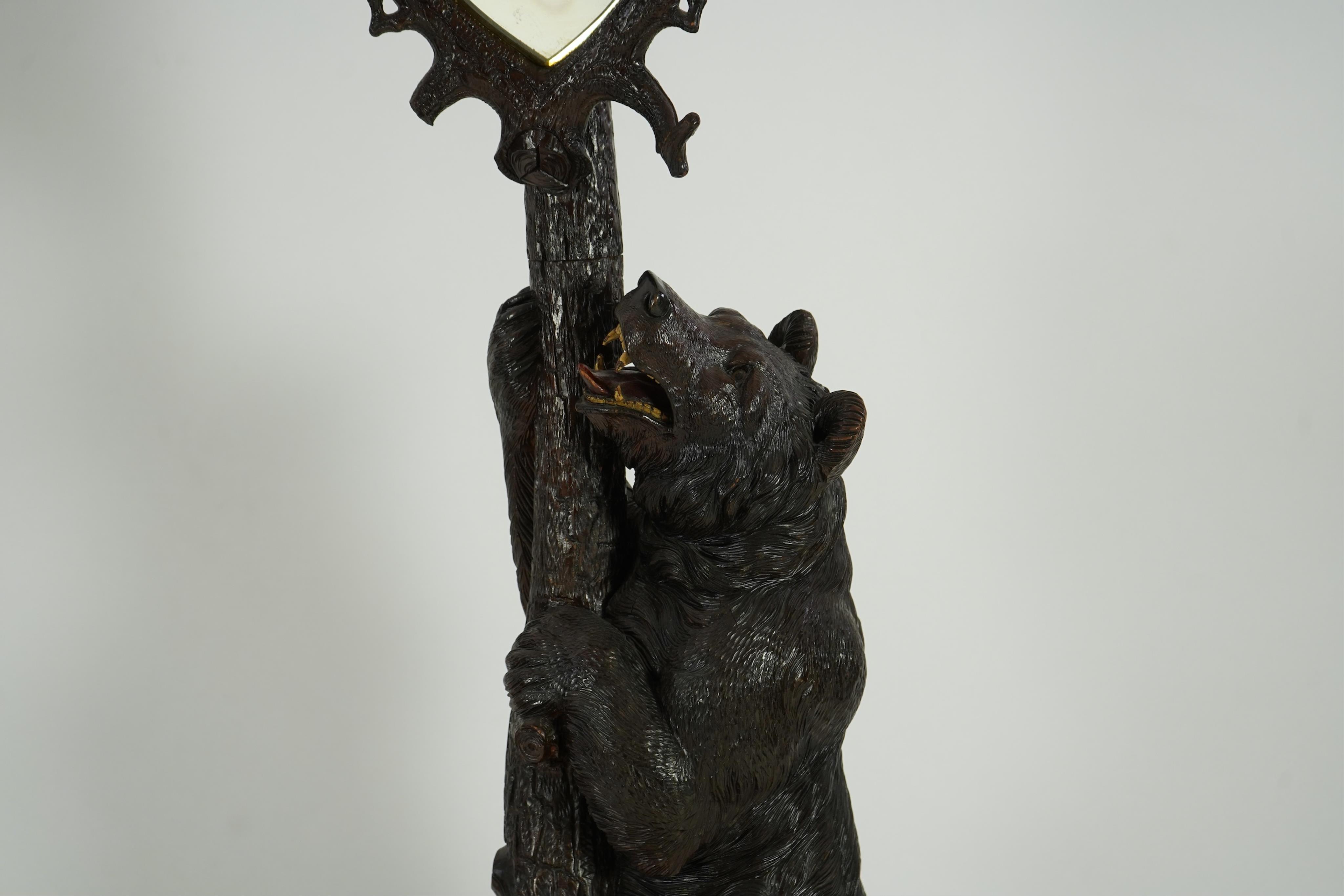 A late 19th century Black forest carved bear hallstand